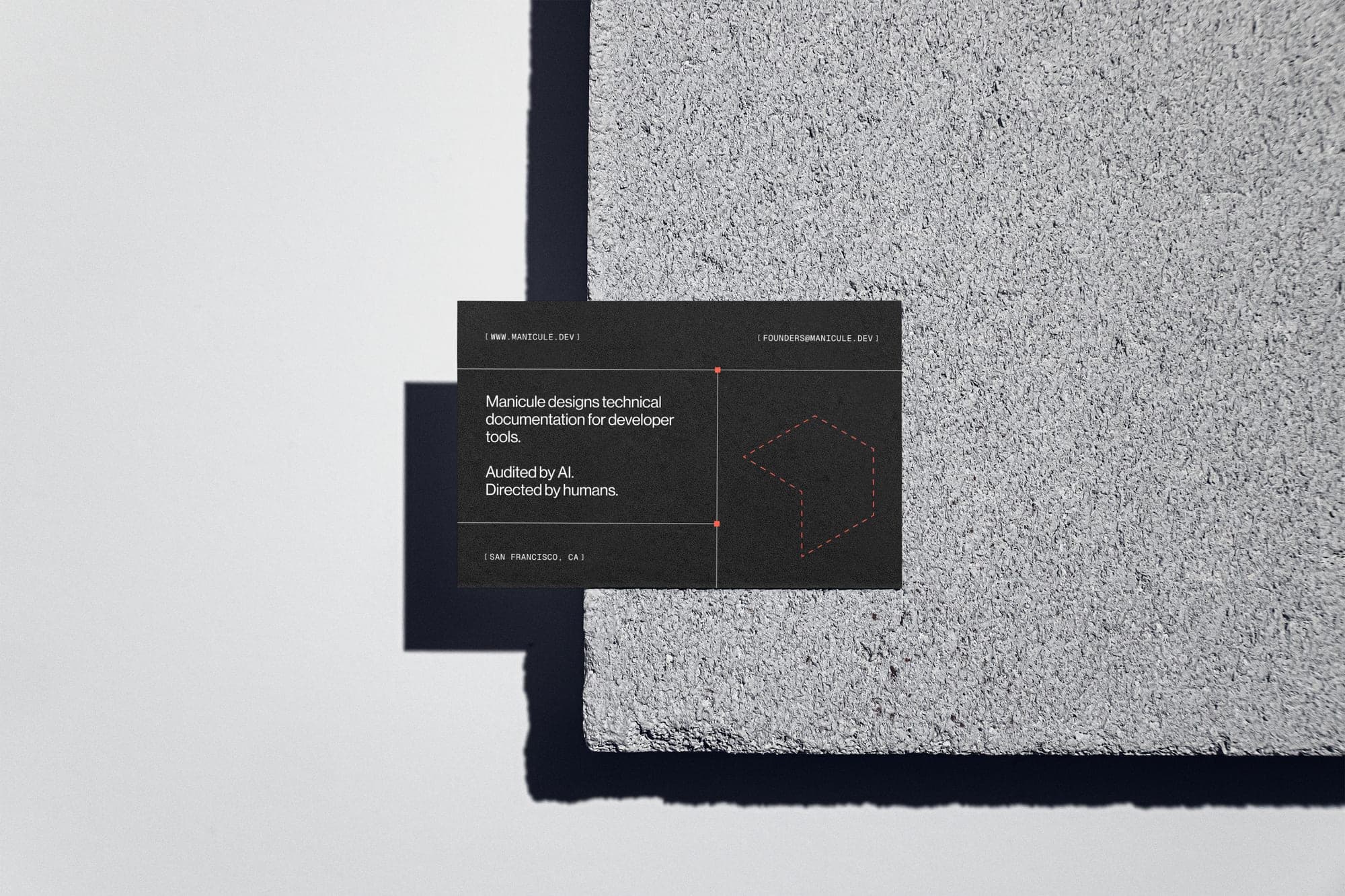 Business card back reading: audited by AI, directed by humans.
